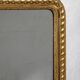 Louis-Philippe mirror with a geometric scalloped frame