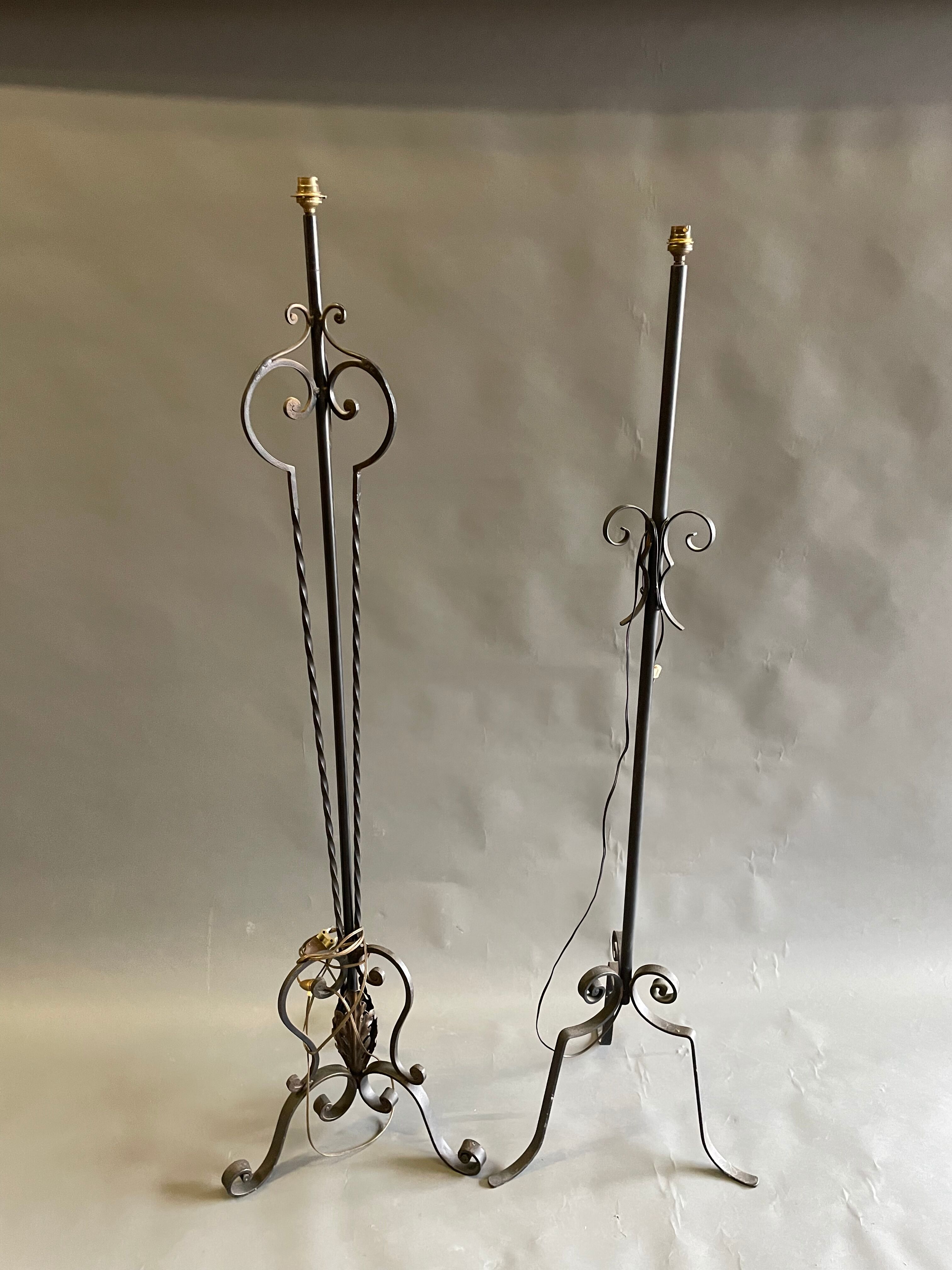 Two wrought iron lamp legs