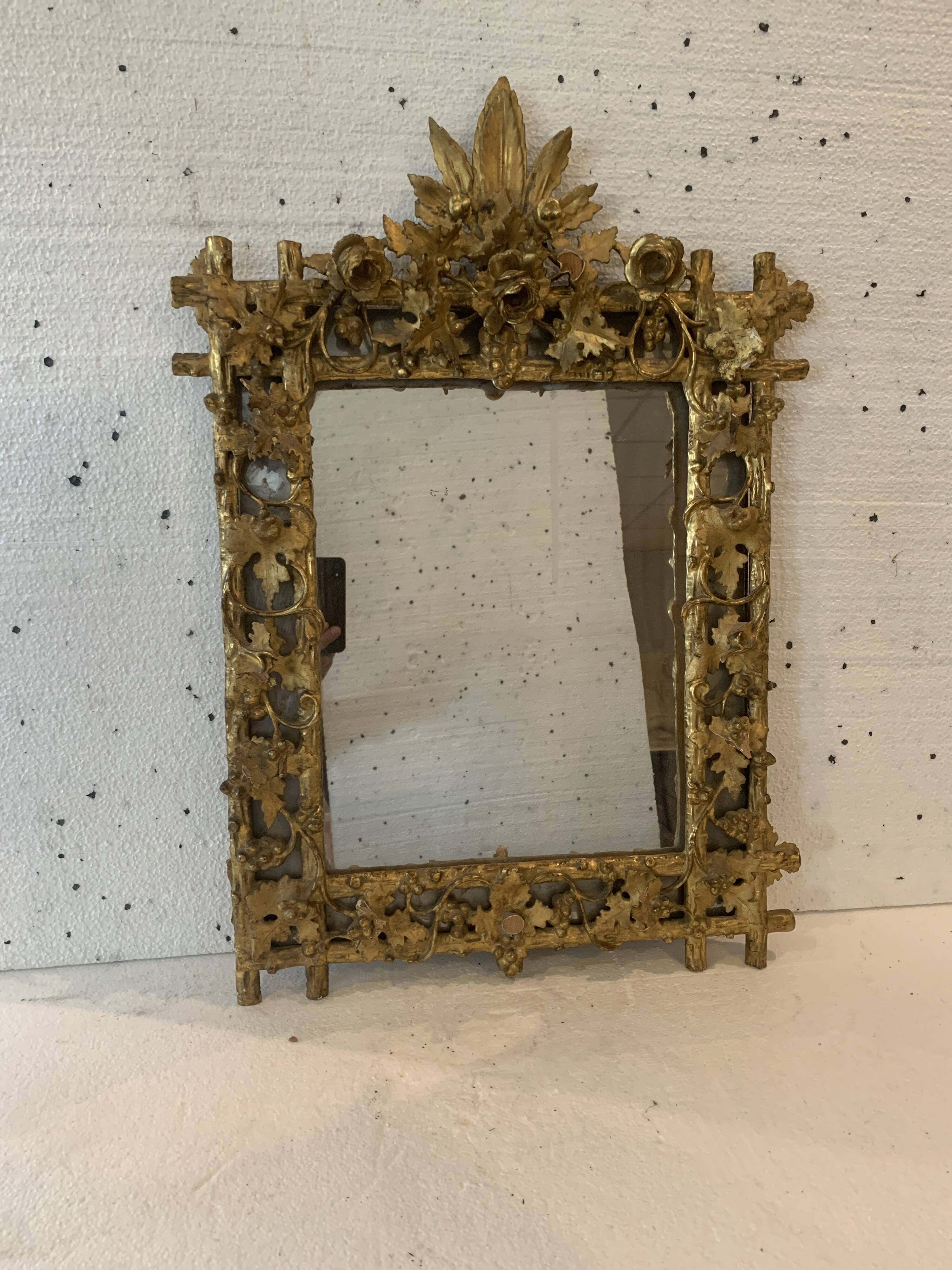 Louis XVI style mirror in carved wood and gilded with gold leaf, 19th century
