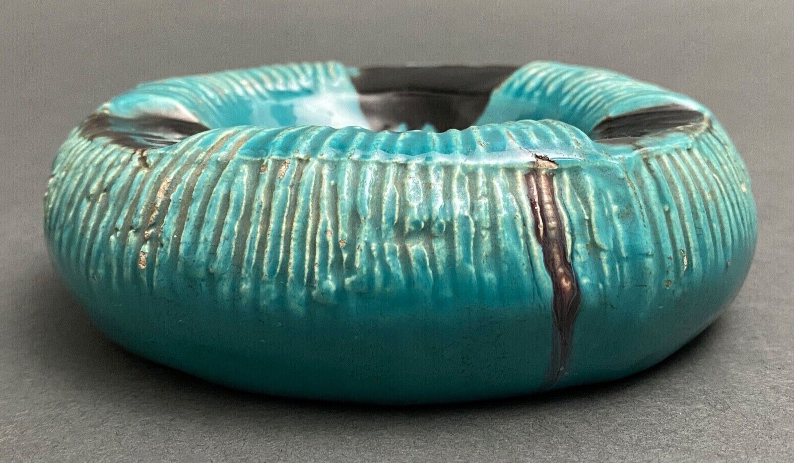 Twentieth century ceramic ashtray decorated with animals on a blue background