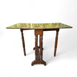 “Gateleg” folding walnut table