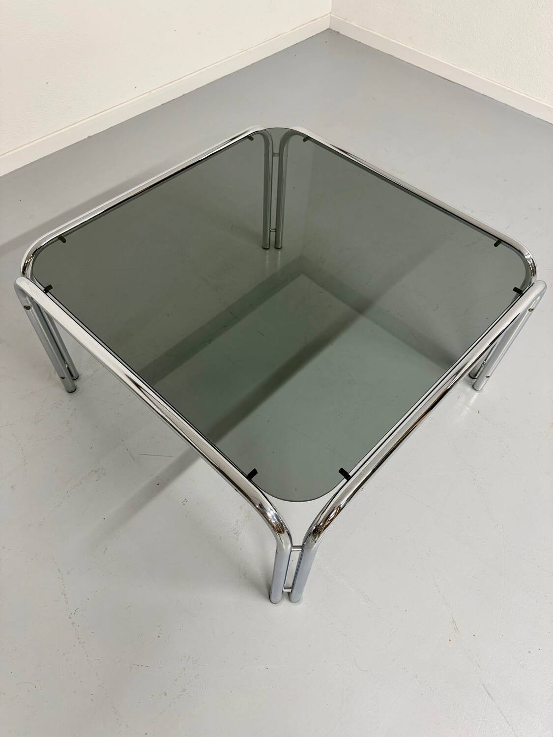 Space coffee table from the 70s, tubular metal and vintage smoked glass