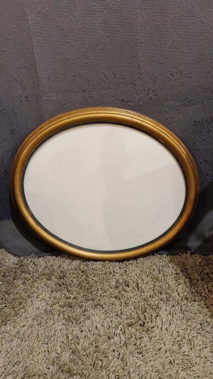 Golden oval frame