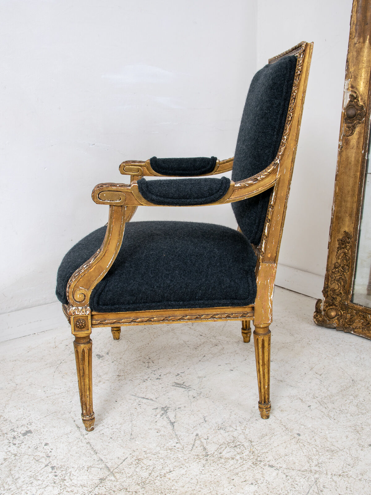 Pair of 19th century Louis XVI gilt armchairs newly re upholstered in holland and sherry fabric