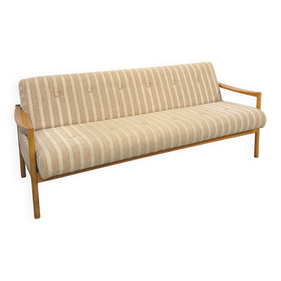 Canapé-lit beige rayé avec cadre en bois