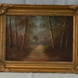 Peinture ancienne paysage sous bois signé.
