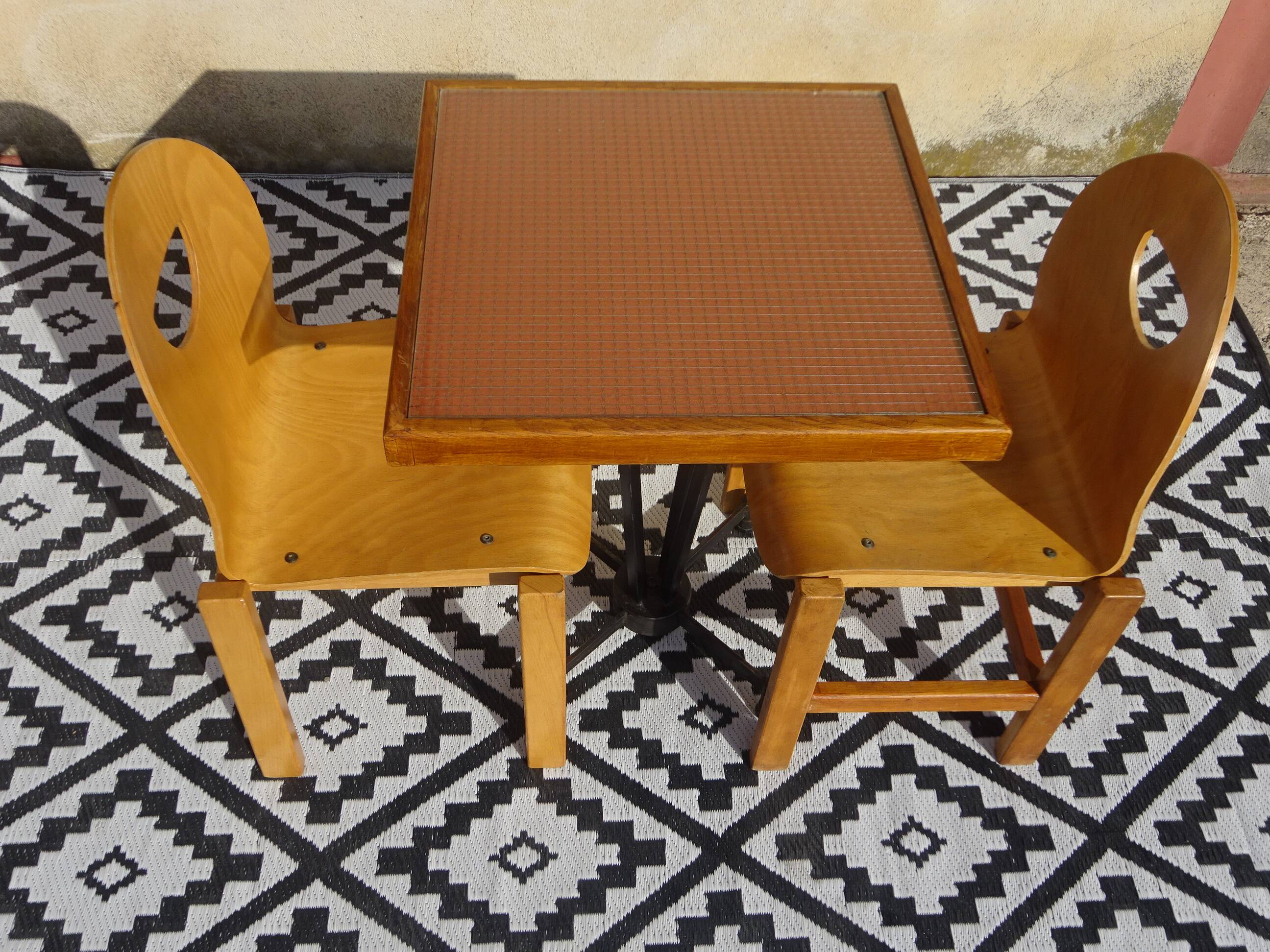 Pair of light wood chairs with post-formed seat and backrest.