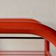 Vintage side table in red tubular steel - smoked glass window - 1980s