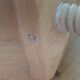 Tripod stool with a screw.