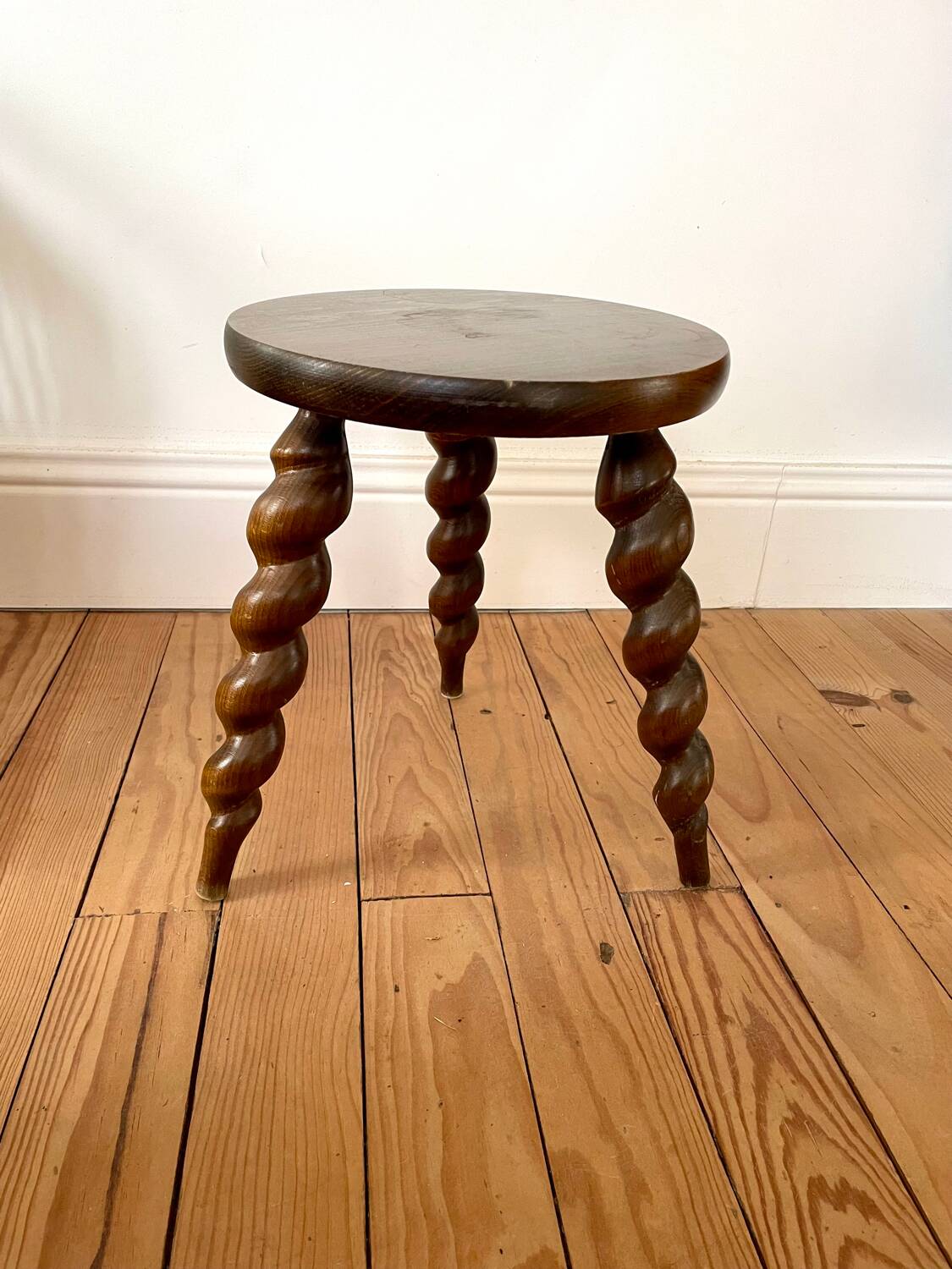Vintage wooden tripod stool with turned legs