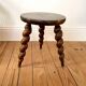 Vintage wooden tripod stool with turned legs