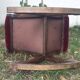 50s footrest in red velvet and scuplented wood