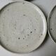 Set of 6 flat plates made of pyrity sandstone, signed