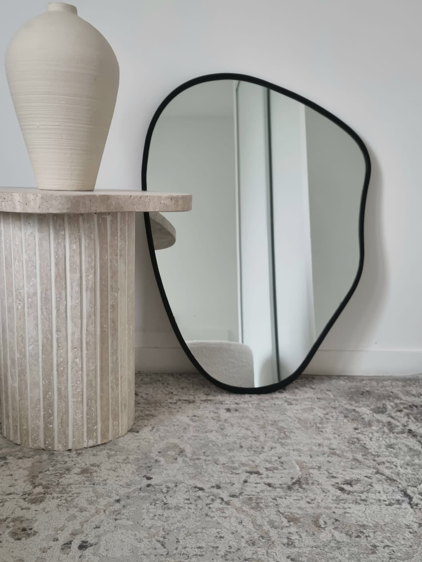 Alpha side table irregular natural travertine ribbed foot