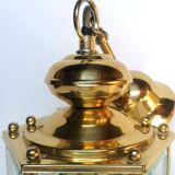 Golden hanging lamp with bevelled glasses