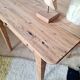 Small old farmhouse table in raw wood.