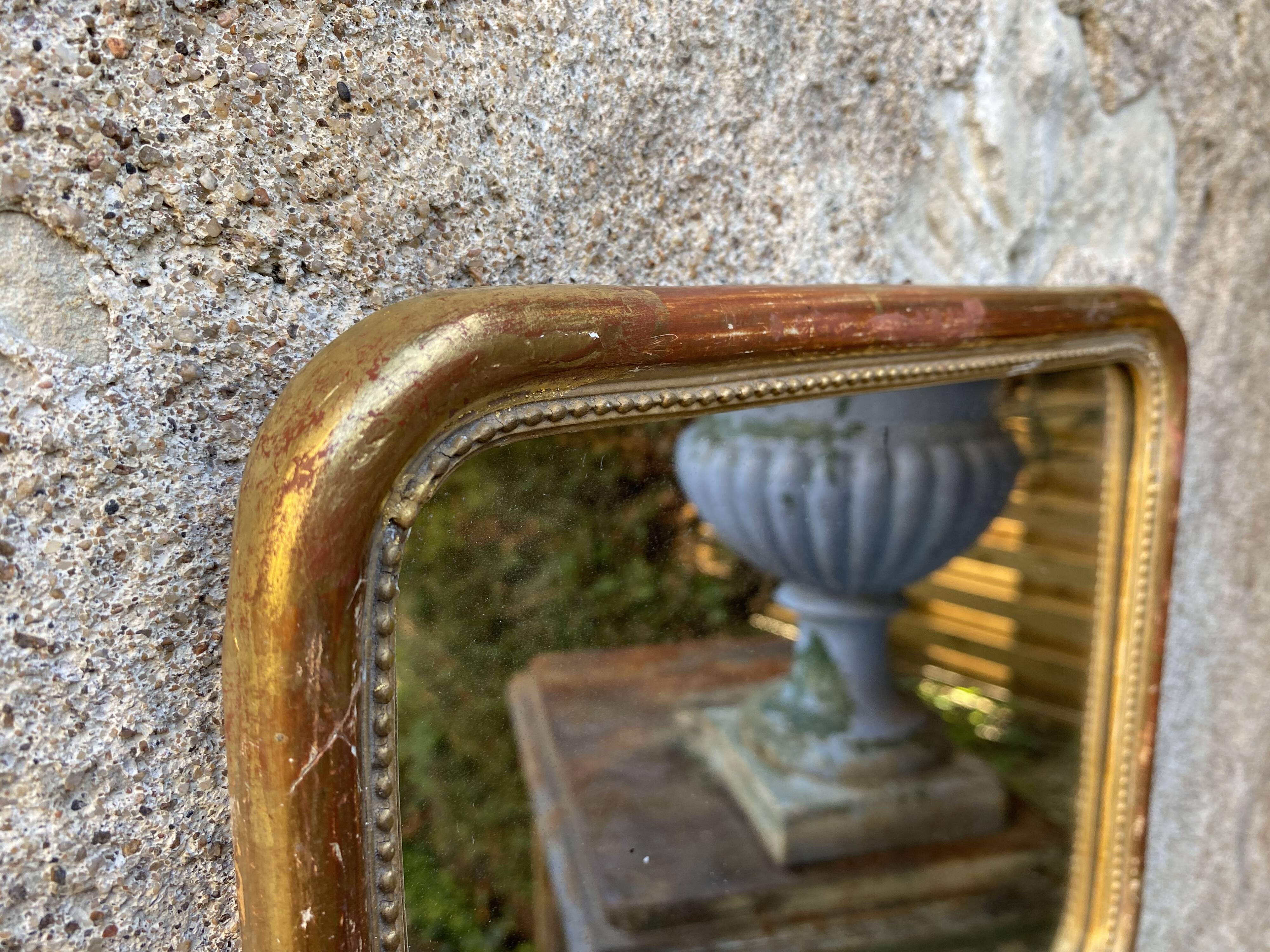 Louis-Philippe mirror gilded with gold leaf