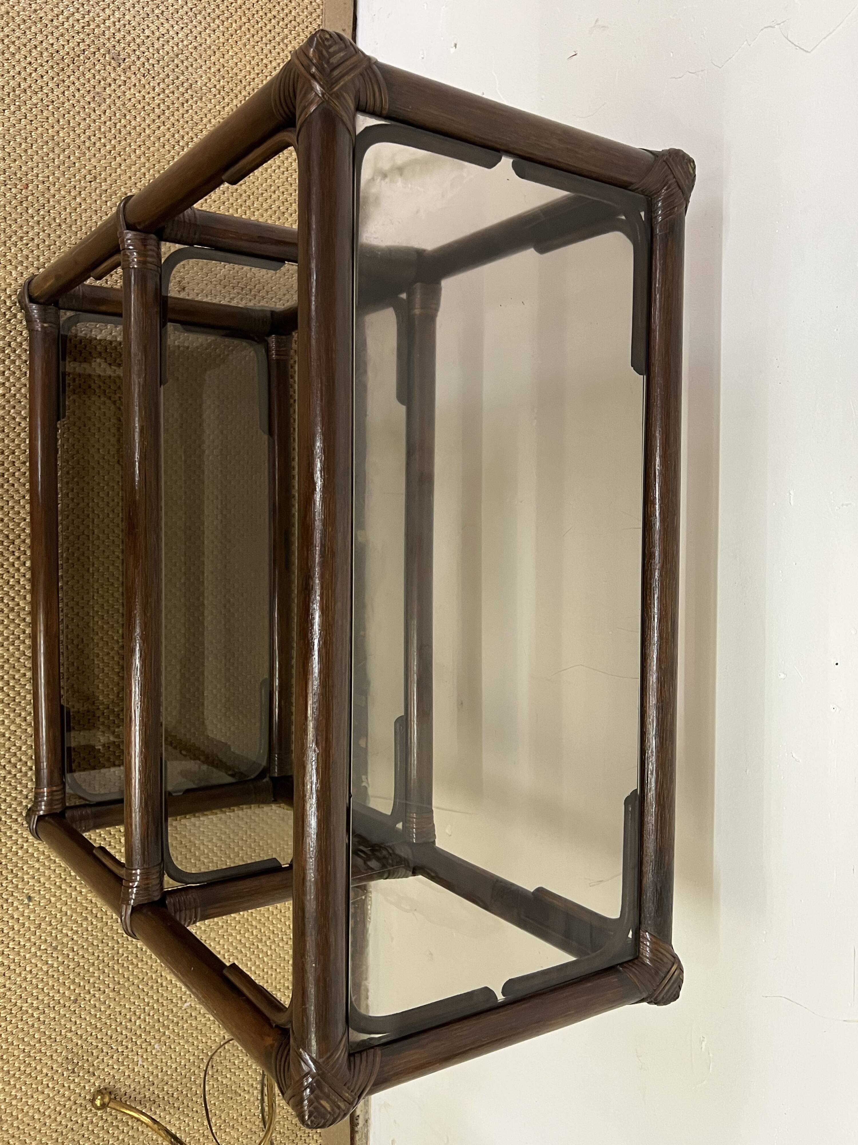 Rattan and smoked glass bookcase shelf