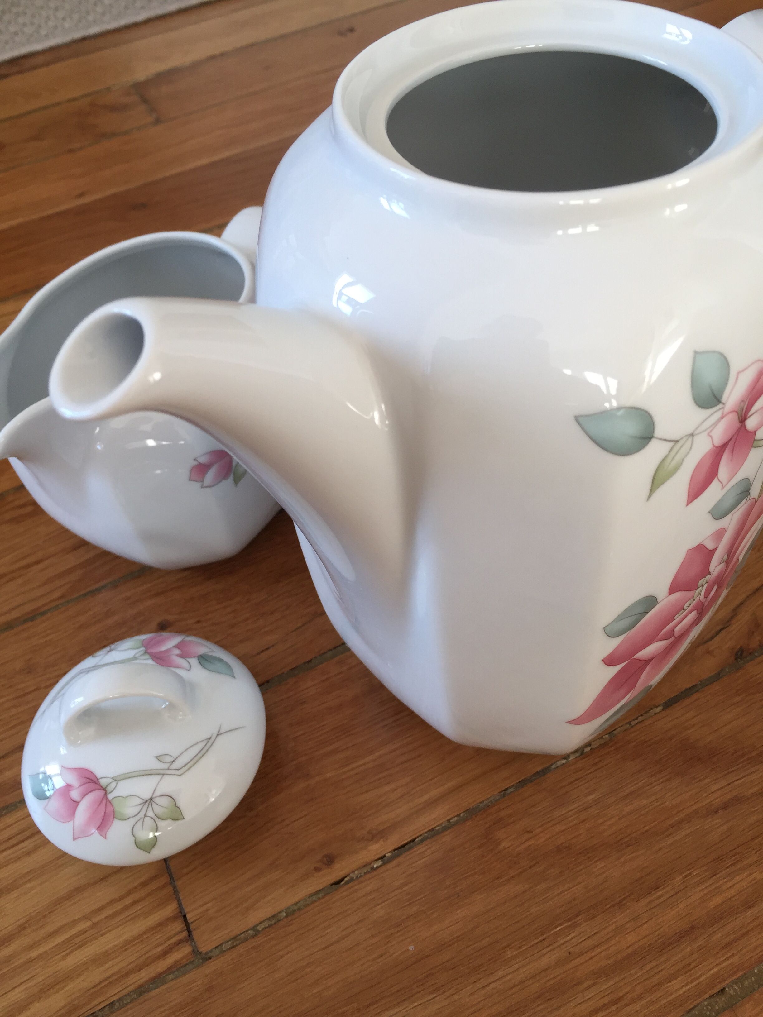 Vintage porcelain coffee or teapot with milk jug