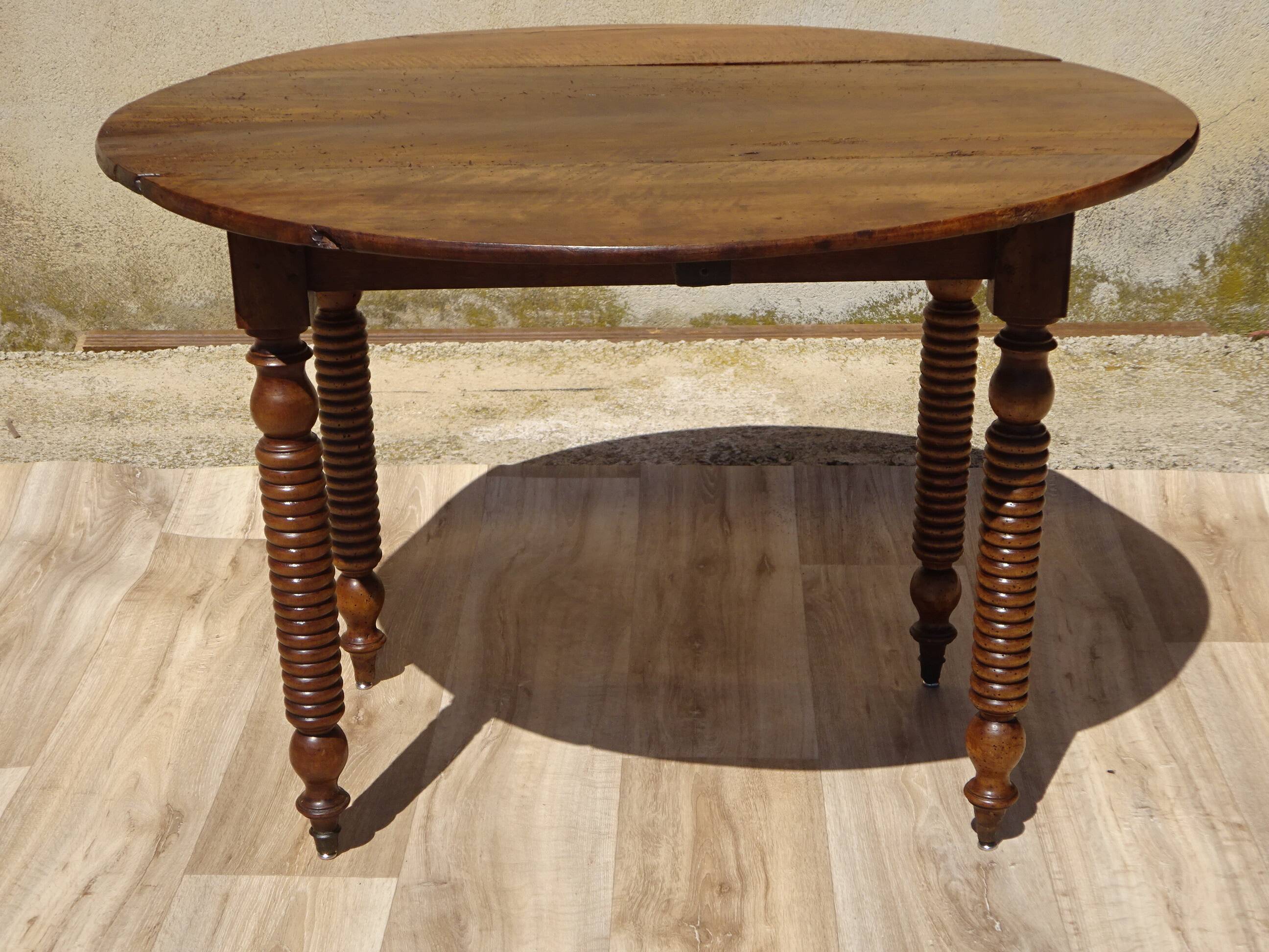 Antique walnut console table with honey spoon legs.