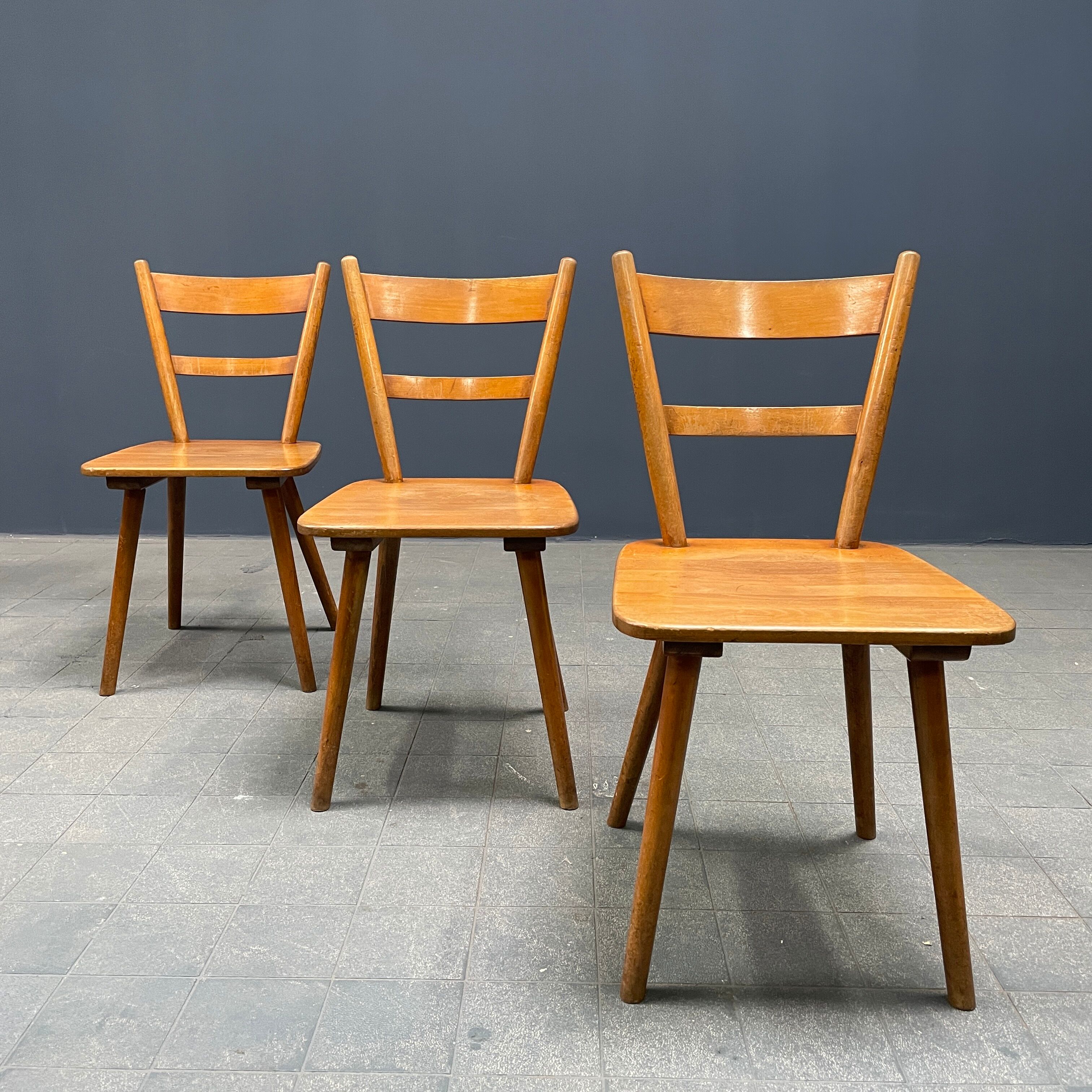 Set of eight german stick chairs from the 1950