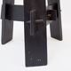 Vintage black-stained wooden tripod stool with mortise joints.