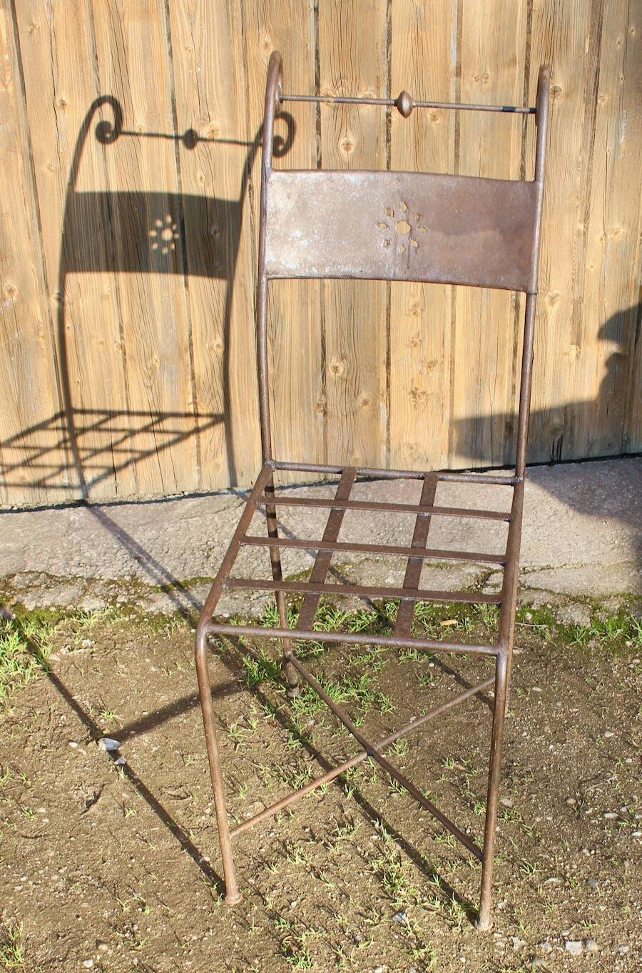 Series of 8 wrought iron garden chairs