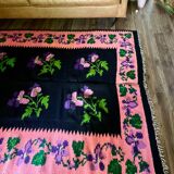 Oltenian floral rug handwoven in wool, purple flowers on black and pink background