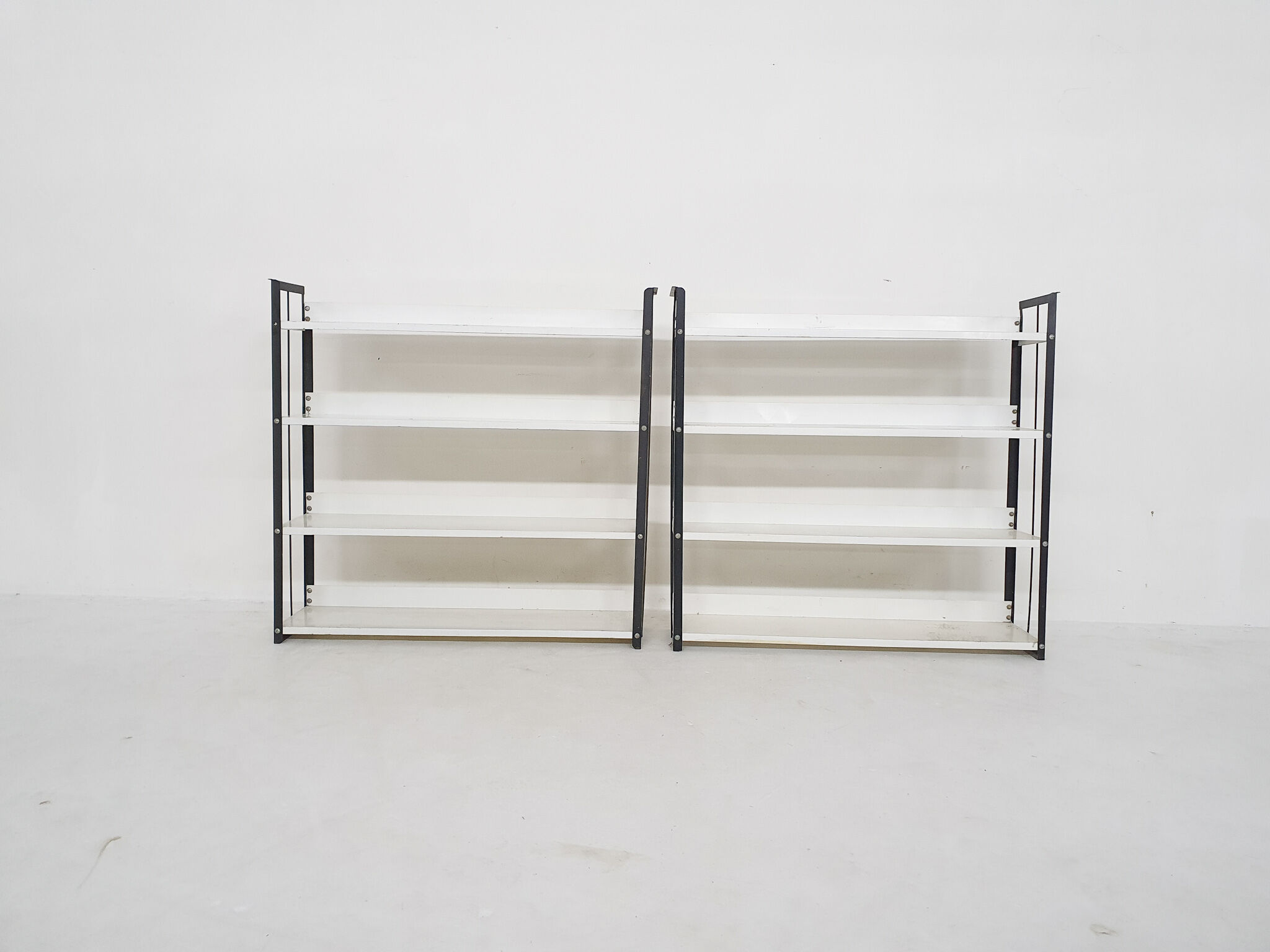 Set of two black and white metal book shelves attrb. to Tomado, Holland, 1950's