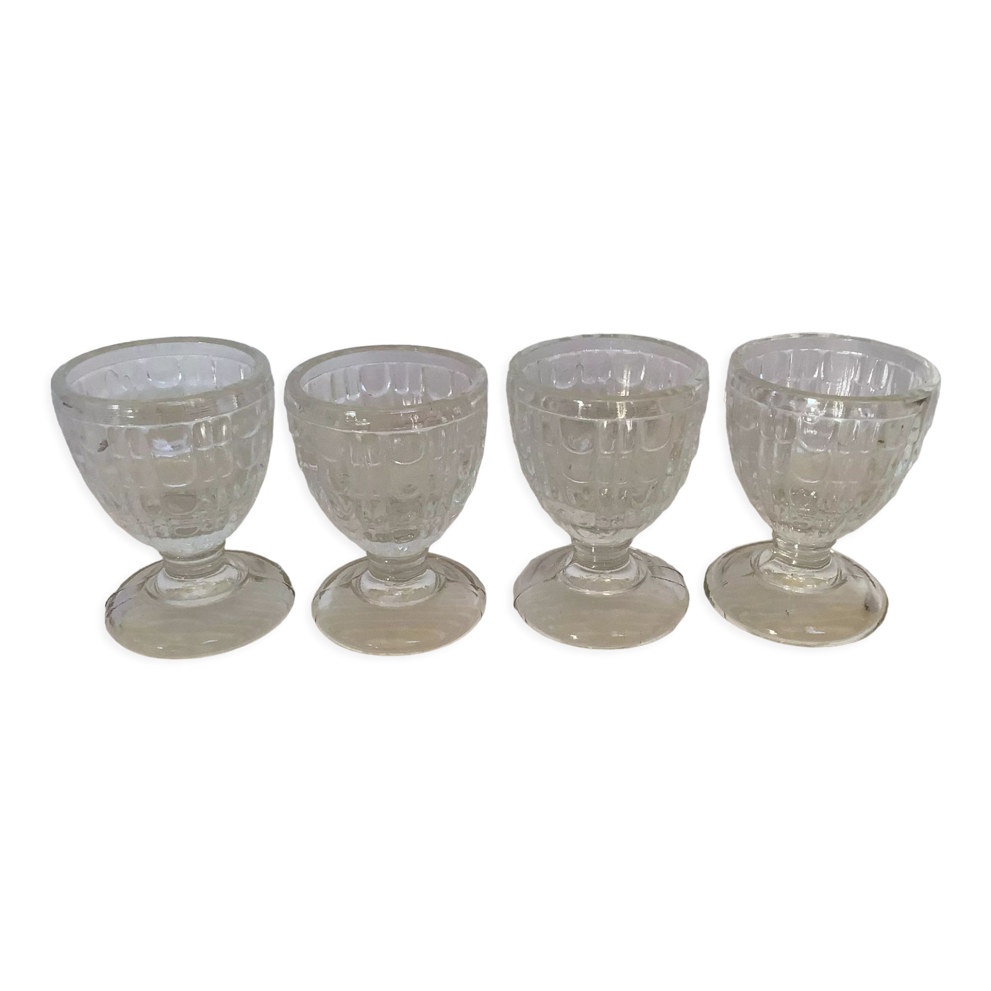 Four old molded glass shells