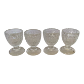 Quatre anciens coquetiers en verre moulé