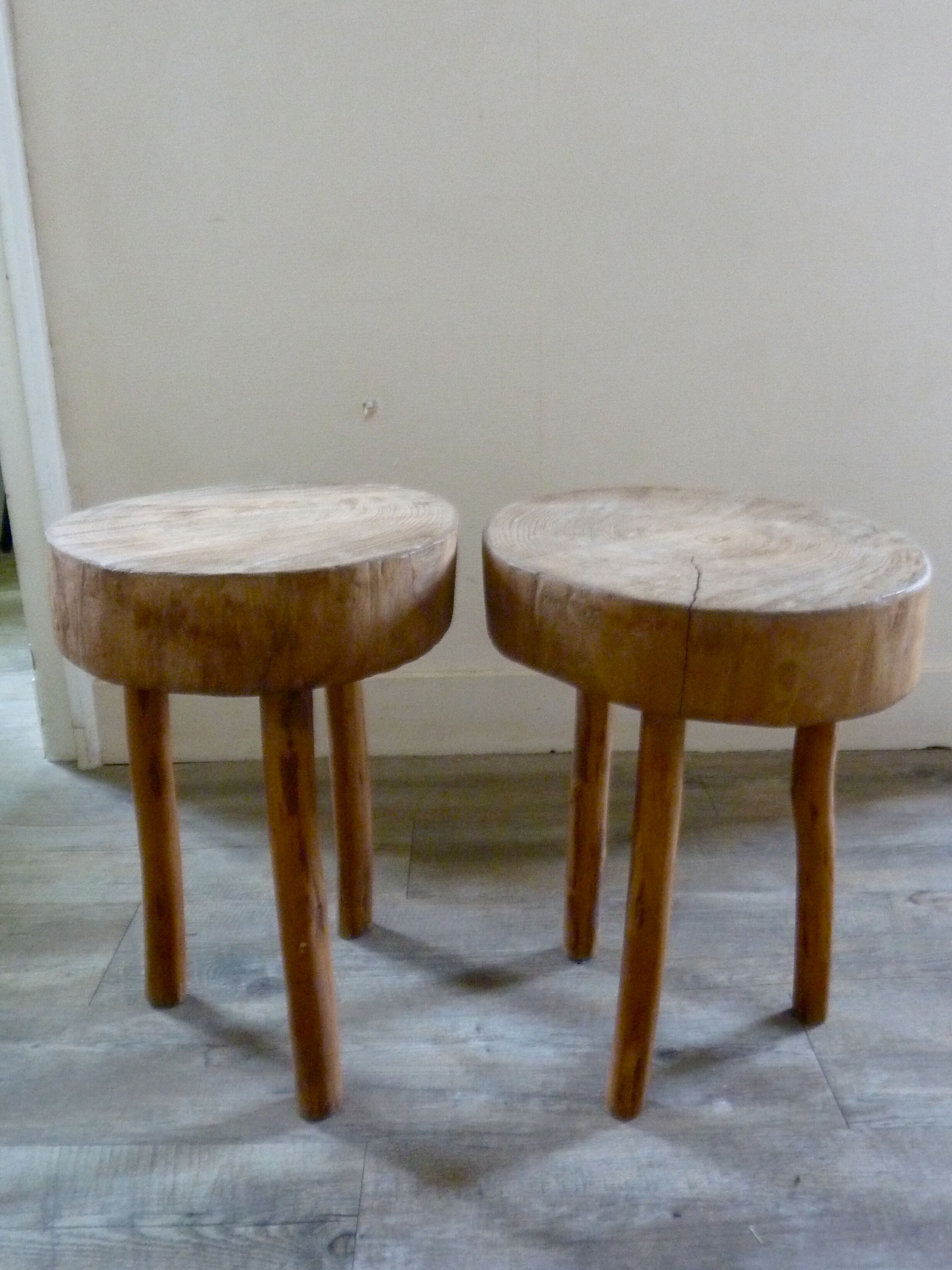 Pair of stools of tripod v with raw wood seat