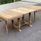 Art Deco dining table with a central pedestal, stripped in solid oak, with 2 extensions.