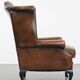 Fauteuil Chesterfield en cuir de vache marron de style anglais