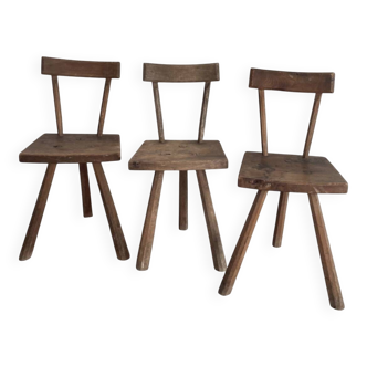Set of three wooden tripod chairs in oak, raw art.
