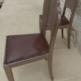 Two restyled leather-style chairs with nails