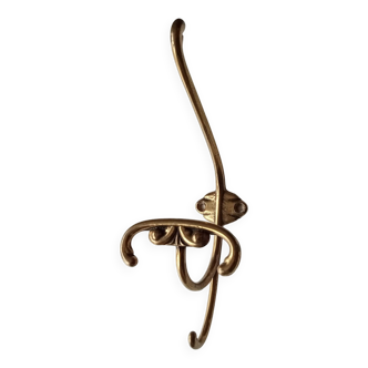 Old coat hook in solid golden brass