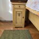 Vintage wooden bedside table painted brown, with a drawer and door, painted decoration from the 1890s.