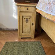 Vintage wooden bedside table painted brown, with a drawer and door, painted decoration from the 1890s.