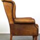 Sheepskin wingback chair with a unique design and a beautiful patina