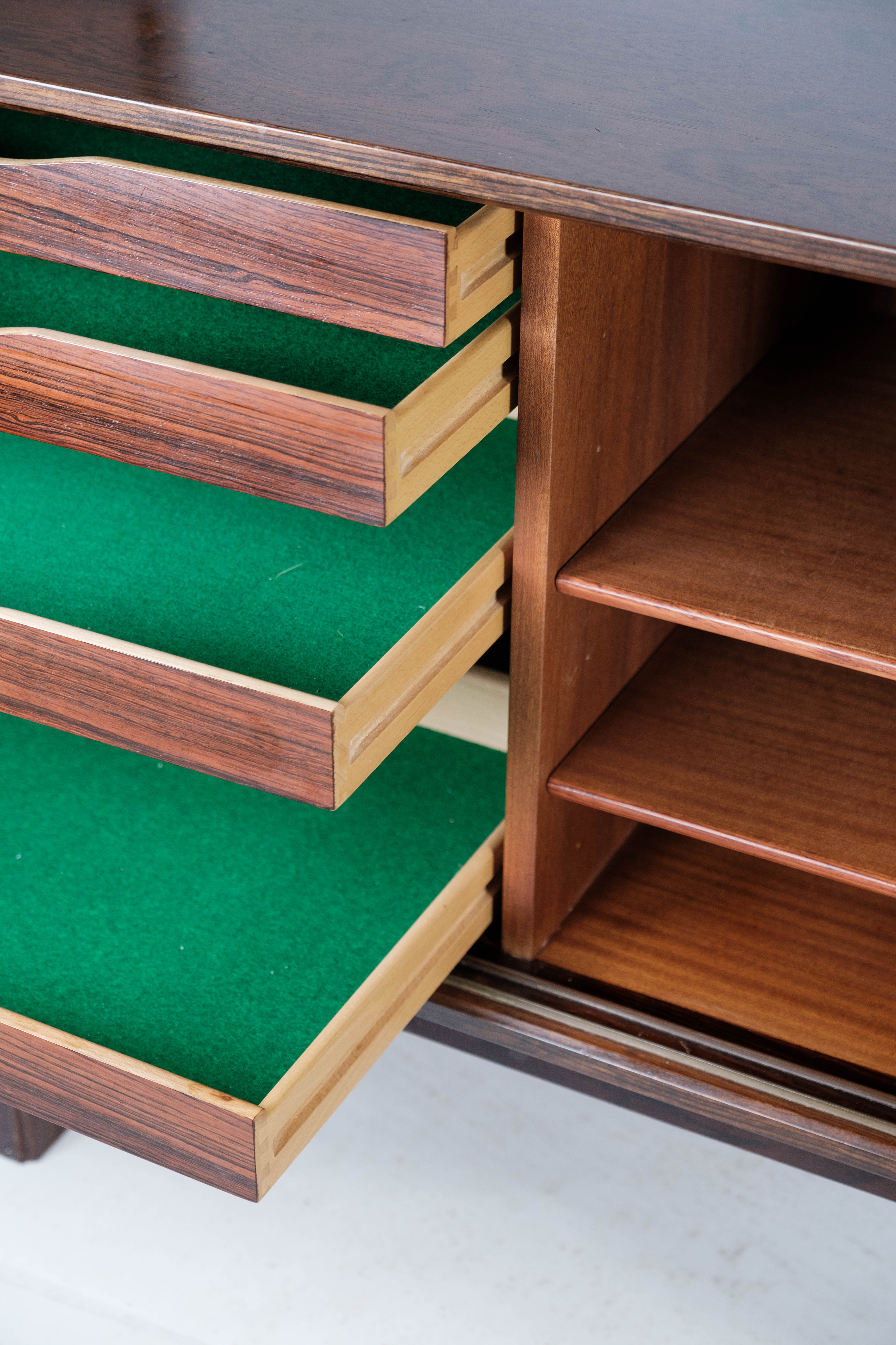 Sideboard in rosewood with sliding doors designed by Omann Junior from the 1960s.