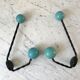 Duo of hooks balls in blue wood and black iron 60s