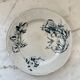 Flat earthenware plate with floral motifs