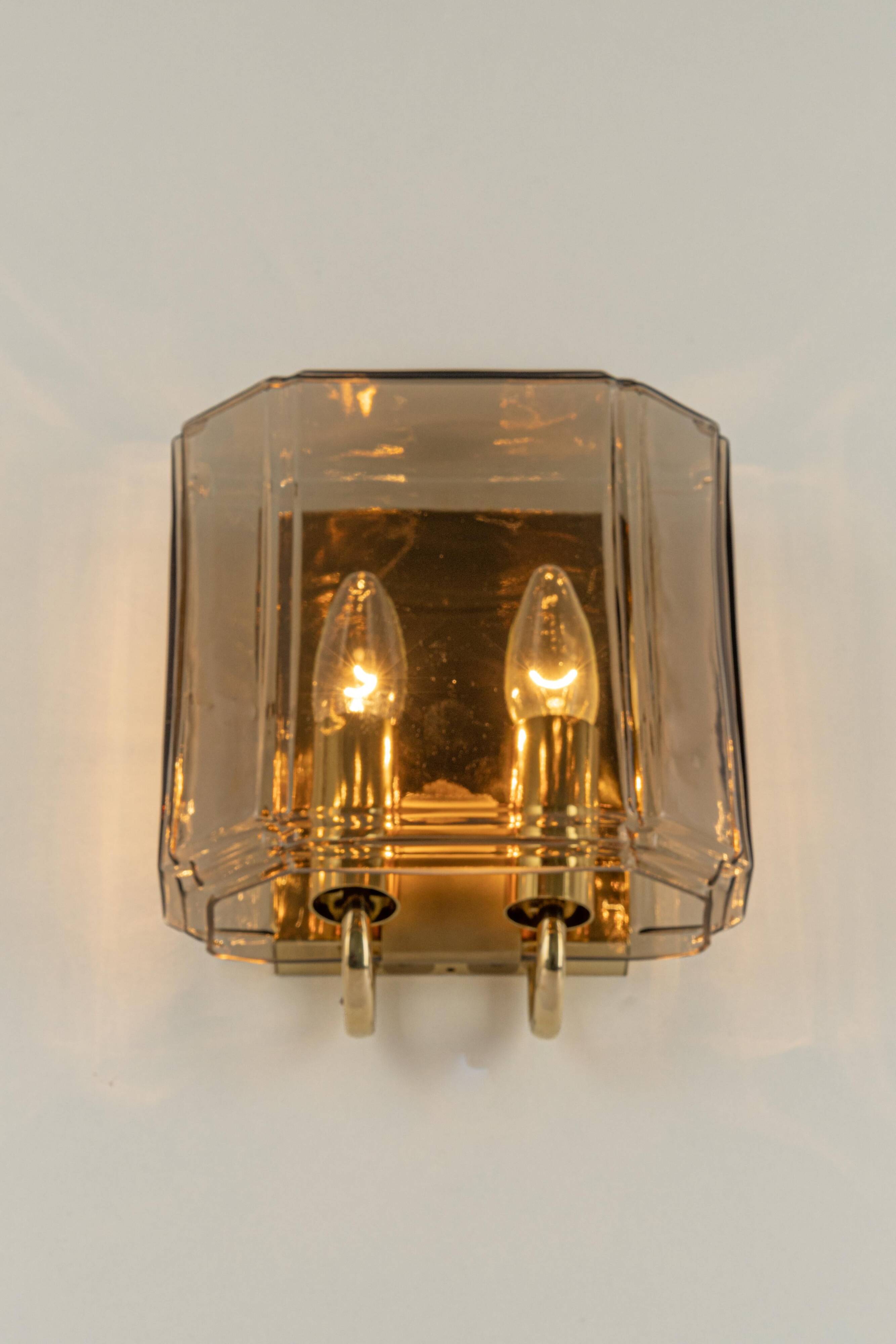 Large smoked glass wall sconces by Limburg, Germany.