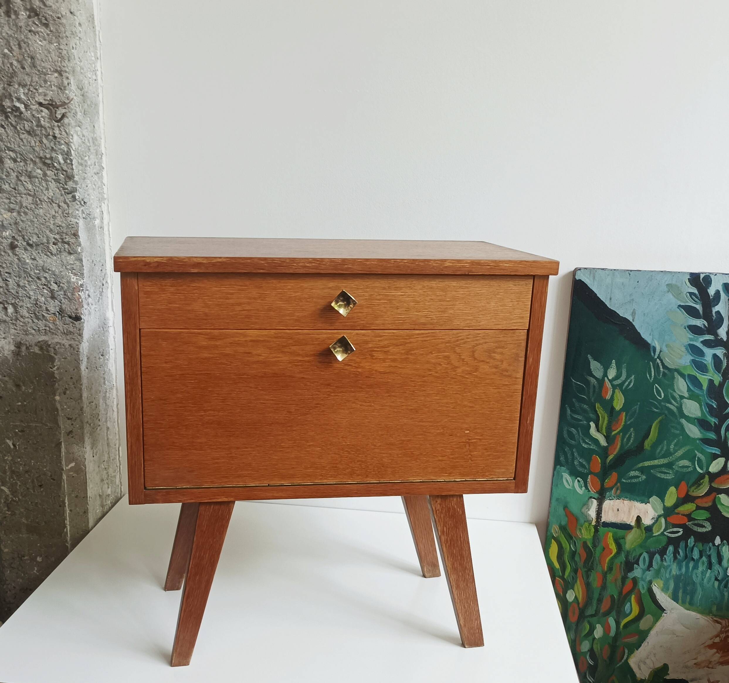 Wooden bedside table with vintage compass legs