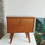 Wooden bedside table with vintage compass legs