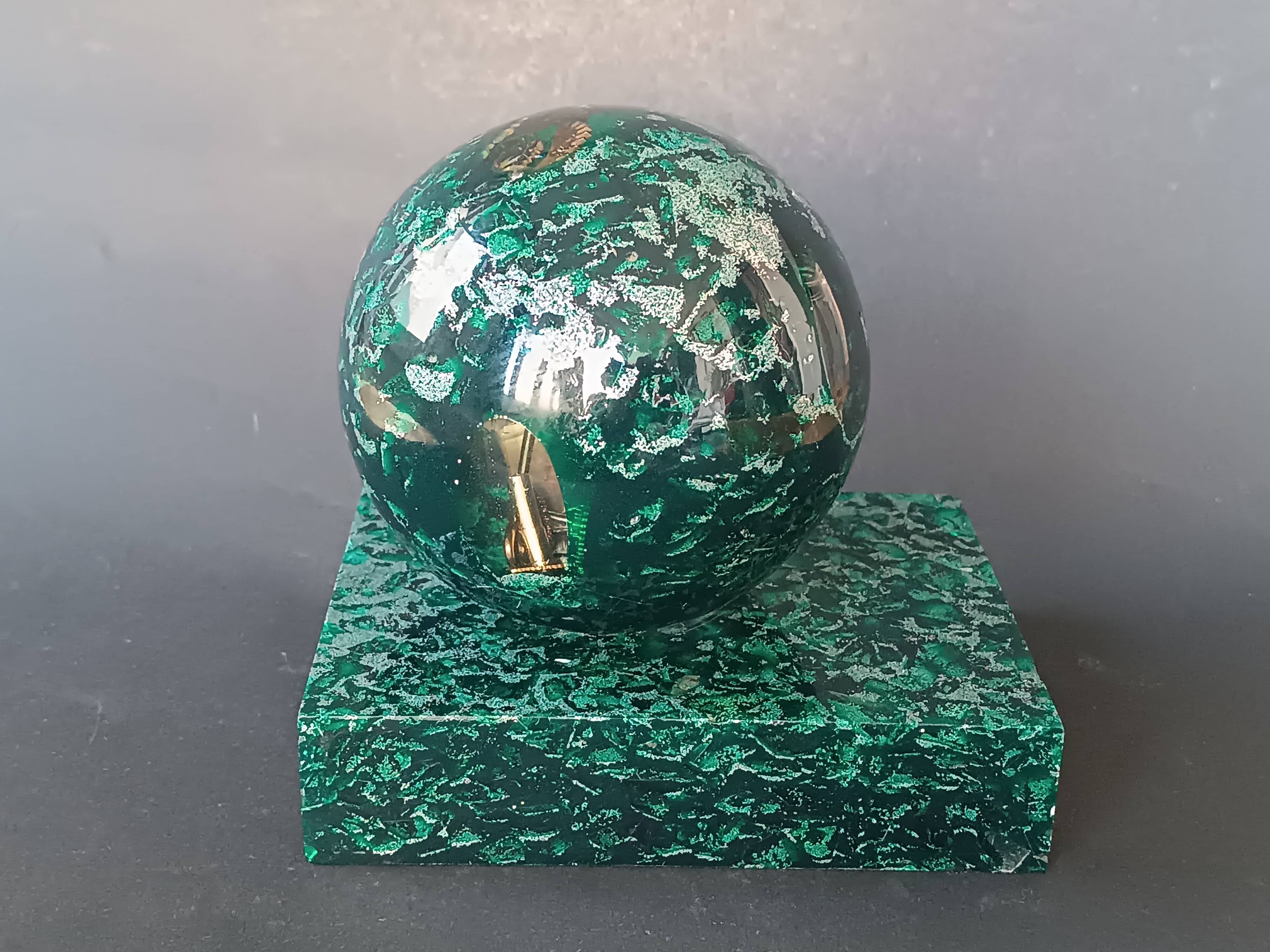 Design bookends in fractal resin with watchmaking inclusions.