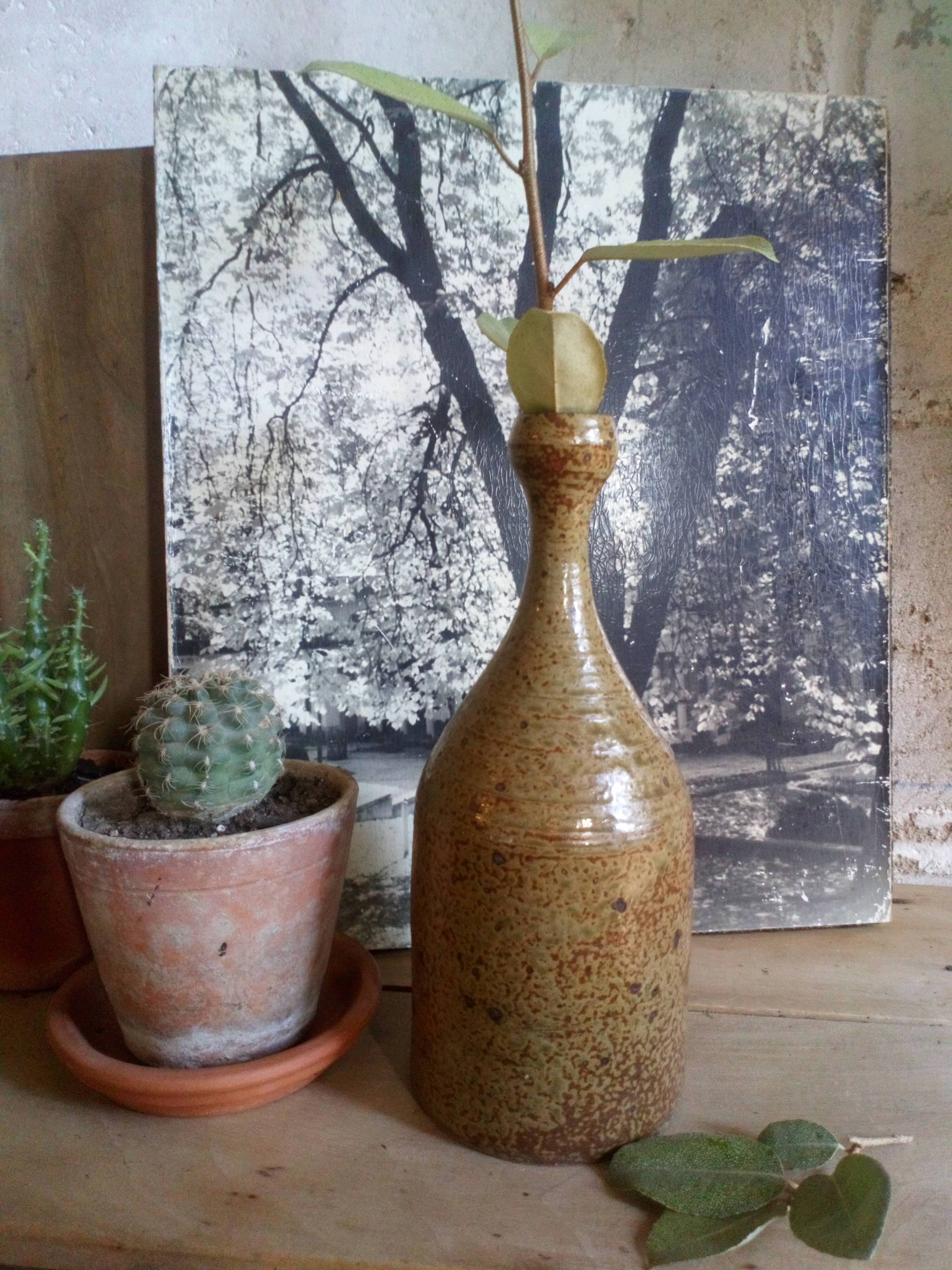 Bottled sandstone vase with a narrow neck