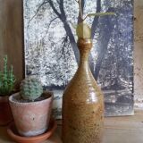 Bottled sandstone vase with a narrow neck