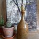Bottled sandstone vase with a narrow neck